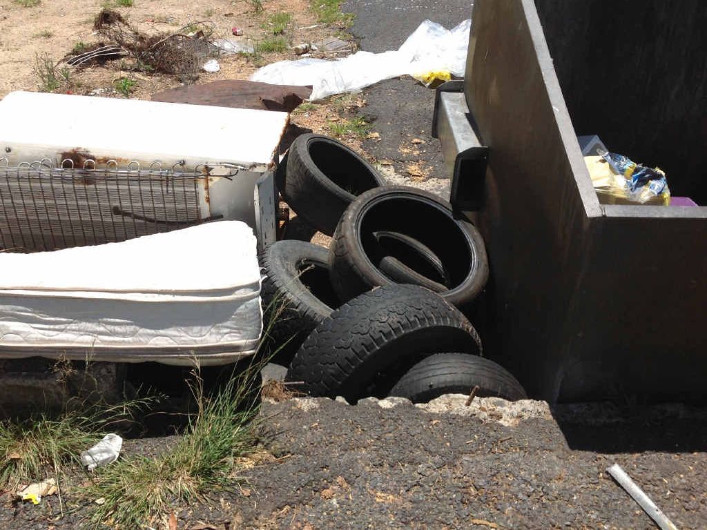 NAUGHTY: Tyres and bulky items dumped illegally at one of the region’s bin enclosures. NAUGHTY: Tyres and bulky items dumped illegally at one of the region’s bin enclosures.